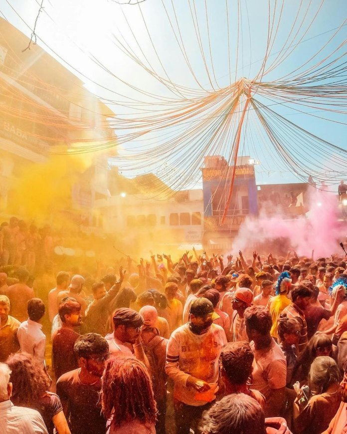A colourful crowd at an open-air festival