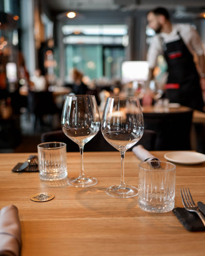 Two wine glasses on a carefully laid table